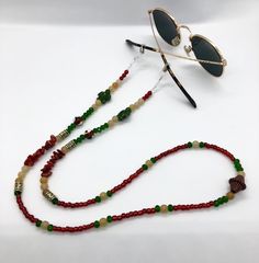 Whether you're headed to a festival, taking a stroll along the beach, or just walking around the block, these sunglass chains are both handy and stylish to bring along for the ride. Convenient if you want to let your glasses hang comfortably on your chest, or put them on to add some flair to any activity you're getting into. Elastic endpieces stretch out and make it easy to slide the chain onto any pair of sunglasses or reading glasses. Each pair is handmade with love in colorful Colorado :) Custom designs are welcome, let me know what you have in mind and I'd love to make it happen! **Photos 3 & 4 are just examples of what they look like on, not necessarily the exact same pair you're looking at. Trendy Adjustable Sunglasses For Travel, Adjustable Sunglasses For Summer Travel, Bohemian Sunglasses With Gradient Lenses For Summer, Bohemian Summer Sunglasses With Gradient Lenses, Trendy Adjustable Glasses Chains, Gradient Glass Sunglasses As A Gift, Bohemian Sunglasses With Uv Protection For Vacation, Gradient Lens Glass Sunglasses As Gift, Multicolor Glass Sunglasses For Festivals