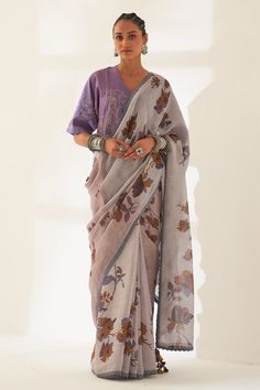 Plum jam lilac pure linen handloom saree with all-over floral patterns prints. Comes with unstitched blouse piece.
Components: 2
Pattern: Printed
Type Of Work: Floral
Fabric: Pure Linen
Color: Purple
Other Details: 
Scalloped hem saree
Tassel edged palla
100 count handcrafted linen base
Dimensions:
Width: 45 inches
Length: 5.5 mtrs
Note:
The unstitched blouse is same as shown in the image.
The stitched blouse and all the jewellery worn by the model is not for sale.
Occasion: Puja - Aza Fashions Saree Tassel, Saree Draping Styles, Plum Jam, Cotton Saree Designs, Hand Painted Sarees, Saree Blouse Designs Latest, Casual Saree, Linen Color, Elegant Saree