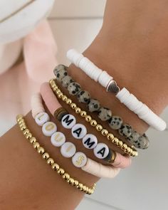 "Brand new to the Louis and Finn, our heishi beads have quickly become an arm party must have! So cute! So fun! Personalize with your wording and pick your favorite color from the drop down menu. Pick from our beautiful pale peachy pink heishi, leopard stones, dainty 4 mm gold beads, white heishi and brand new to the shop -- mauve heishi! We have now added the option to shop this EXACT look! If you select \"set of 6 bracelets\" from the dropdown menus, the bracelets will come as displayed (2 gol Trendy Heishi Beads Friendship Bracelets As Gift, Trendy Heishi Beaded Bracelets As Gift, Trendy Heishi Beads Bracelet For Gift, Trendy Heishi Beads Bracelet As Gift, Personalized Adjustable Heishi Beaded Bracelets, Personalized Adjustable Heishi Beads Bracelet, Trendy Beaded Bracelets With Letter Beads For Birthday, Trendy Heart Beads Bracelets For Mother's Day, Everyday Heishi Beads Bracelet