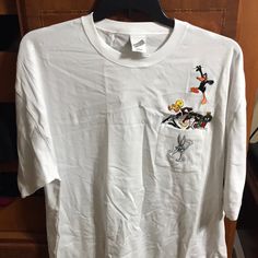 Warner Bros. Studio Store Authentic Wb Tshirt With Embroidered Bugs Bunny, Tweety, Sylvester, Daffy Duck, Marvin The Martian And Taz. Nwt From A Smoke Free And Pet Free Home. White Relaxed Fit Top With Embroidered Logo, White Cotton Shirt With Embroidered Logo, White Cotton T-shirt With Embroidered Graphics, White Casual Shirt With Embroidered Logo, White Relaxed Fit T-shirt With Embroidered Graphics, Casual White Tops With Embroidered Logo, White Cotton Shirt With Embroidered Graphics, White Embroidered Crew Neck Shirt, White Embroidered T-shirt With Relaxed Fit