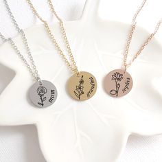 Personalized coin birth flower with name necklace, this pendant makes a great birthday gift for daughter, mom and grandma and also for your best friends. You can customize the front of the pendant with the birth flower  of your choice and a name. The disc necklace is made of stainless steel and it measures 0.8" / 18 mm available in four colors: gold, rose gold, black and silver. The pendant comes with and adjustable stainless steel (18-20") chain that will fit just perfect on any body type. This keepsake can be purchased with or without a birthstone and it can be engraved on the front only or to make it even more personal  we can engrave one of the following options on the back side. OPTION 1: "NO engraving on back" We will not engrave anything on the back, the back will be blank. OPTION 1 Personalized Birth Flower Medallion Jewelry, Birth Flower Medallion Jewelry For Personalized Gift, Personalized Birth Flower Medallion Necklace, Mother's Day Round Charm Necklace With Flower, Mother's Day Round Flower Charm Necklaces, Mother's Day Round Flower Charm Necklace, Rose Gold Necklace With Engraving Option For Mother's Day, Personalized Flower Pendant Jewelry For Birthday Gift, Birthday Charm Necklace With Birth Flower For Mother's Day