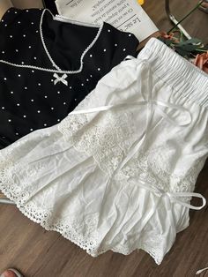 Fabric: 100% cotton Size Guide: Skirt: S: length: 31.5cm, high waist: 62cm, hips: 88cm M: length: 32.5cm, high waist: 66cm, hips: 92cm L: length: 33.5cm, high waist: 70cm, hips: 96cm There are shorts under the skirt* This Angelic Doll Cotton Mini Skirt is the perfect addition to your spring and summer wardrobe. Made with soft white cotton, the skirt features an angelic and coquette style, making it versatile and easily paired with any pastel-colored top for spring and summer wear. Flowy Mini Skort In Cotton, Spring Cotton Mini Skirt, Summer Cotton Mini Skirt, Cotton Mini Skirt For Spring, Spring Cotton Short Skirt, Spring Cotton Skirt Short Length, High Waist Cotton Mini Skirt With Lining, Spring Short Cotton Skirt, Cotton Skirted Skort With Lined Skirt