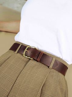 The product:  the whisky belt is agile and soft to touch.  both casual and sophisticated.  this all rounder belt glides well into a suit pant while feeling entirely comfortable wrapped around your casual jeans.    features:  handmade from full grain cow hide with a solid brass buckle.    dimensions:  width - 4cm  length - available in any length    sizing:  to determine your belt size go one size up from your pant size.  for example if you are a pant size 36 you will be a belt size 38. Brown Belt With Brass Buckle For Work, Brown Workwear Belt With Brass Buckle, Formal Brown Belts And Suspenders With Brass Buckle, Classic Removable Belt For Workwear, Brown Business Belt With Brass Buckle, Classic Brown Belt With Brass Buckle, Brown Leather Belt Buckles For Work, Classic Leather Belt Buckles For Fall, Leather Belt Buckles With Brass Buckle For Work