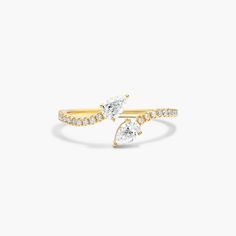 Feel fabulous in this bypass ring that is simultaneously bold and elegant. Get ready for all the compliments when wearing this stunning silhouette. Fine Jewelry Anniversary Bypass Ring With Open Band, Elegant Yellow Gold Pear-shaped Ring, Elegant Yellow Gold Pear Shaped Rings, Elegant Pear-shaped Yellow Gold Rings, Fine Jewelry Bypass Ring For Formal Events, Formal Fine Jewelry Bypass Ring With Open Band, Luxury Open Band Bypass Ring For Anniversary, Formal Fine Jewelry Bypass Ring, Luxury Open Bypass Ring For Anniversary