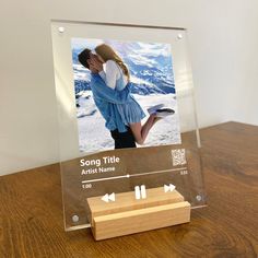 a clear acrylic plaque with an image of a couple kissing