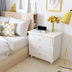 a bedroom with white bedding and yellow accents