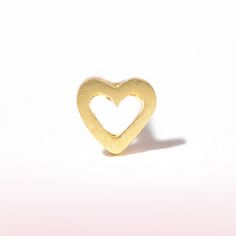 Elevate your ear stack with this delicate and minimalist stud showcasing a simple, dainty heart outline. Handcrafted in solid gold and perfect for everyday wear. Dainty Yellow Gold Heart Earrings For Everyday Wear, Gold Minimalist Heart Earrings For Everyday, Gold Heart Earrings For Everyday, Minimalist Heart Earrings For Anniversary, Everyday Gold Heart Earrings, Minimalist Heart Pendant Earrings For Everyday, Dainty Double Heart Earrings For Everyday, Dainty Heart Earrings For Everyday, Minimalist Everyday Heart Pendant Earrings