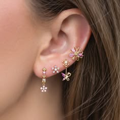 Delicate pink florals paired with fluttering butterflies add a touch of magic to your everyday look. You'll get lost in the stunning and calming baby pink hues of the cubic zirconia stones. Whimsical Pink Earrings With Flower Charm, Pink Flower-shaped Cubic Zirconia Jewelry, Pink Whimsical Flower Earrings For Pierced Ears, Pink Jewelry With 3d Flowers For Party, Pink Whimsical Flower Earrings With Flower Charm, Whimsical Pink Flower Earrings For Pierced Ears, Pink Whimsical Flower Charm Earrings, Whimsical Pink Flower Charm Earrings, Dainty Pink Flower Jewelry