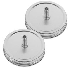 two round metal lids with screws on each side