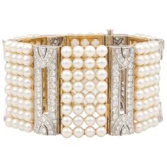 The diamond and pearl cuff bracelet of geometric design features six sections each set with 32 Japanese Akoya pearls for a total of 192 lustrous pearls of 4.5 mm diameter. The six bridges connecting these sections are set with a total of 10.73 carats of round diamonds of top quality (F/G-VVS, color, clarity and cut). The elegant bracelet is one-of-a-kind. It was entirely handmade in Italy with exquisite openwork craftsmanship and knowhow by maestro Salvatore according to an original design by El Diamond Cuff Bracelet, Pearl Cuff Bracelet, Diamond Bracelet Design, Pearl Cuff, Modern Bracelets, Tahitian Black Pearls, Antique Bracelets, Gold Bracelet Cuff, Pearl Design