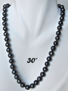 "PREMIUM ROUND 9-9.5mm BLACK PEARL NECKLACE Elegant Round shaped black cultured freshwater pearl necklace; Handpicked by experienced jewelers for their luster, color and cleanliness; Available in other pearl sizes (6mm to 12mm) and other colors (white, peach). EXQUISITE CRAFTSMANSHIP Carefully double knotted between each pearl; Finished with sturdy rose-shaped clasps; This fine pearl jewelry is a symbol of wisdom and is believed to offer protection and attracts good luck and wealth. LUXURY JEWEL Classic Tahitian Pearl Jewelry With Round Beads, Classic Tahitian Pearl Necklace For Anniversary, Single Strand Tahitian Pearl Jewelry With Round Beads, Elegant 8mm Beads Jewelry For Anniversary, Classic Jewelry With 8mm Round Beads, Black Tahitian Pearl Single Strand Jewelry, Classic 8mm Beads For Jewelry Making, Black Tahitian Pearl Jewelry With Round Beads, Black Tahitian Pearl Round Beads Jewelry