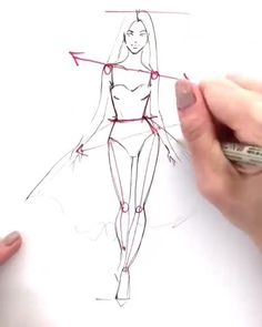 someone is drawing a woman's body on paper