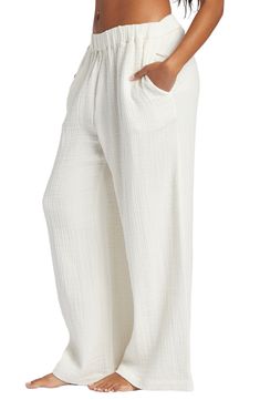 Perfect for casual days spent strolling the boardwalk, this pair of wide-leg pants is made from airy, gauzy cotton for a flowy fit. 27" inseam; 28" leg opening; 12" front rise; 14" back rise (size medium) Elastic waist Side-seam pockets 100% cotton Machine wash, tumble dry Imported White Breezy Loungewear Bottoms, Breezy White Loungewear Bottoms, Breezy White Bottoms With Relaxed Fit, White Relaxed Wide Leg Pants With Elastic Waistband, White Wide Leg Breezy Bottoms, White Breezy Wide Leg Bottoms, Breezy White Wide Leg Bottoms, Cotton Ankle-length Wide Leg Pants For Beach, Cotton Wide Leg Ankle-length Pants For Beach