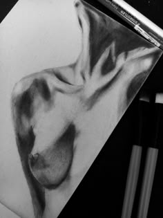 a pencil drawing of a woman's torso