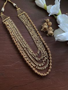 24 K gold plated beaded long necklace with matching delicate earrings Highest quality and craftsmanship Indian Bridal Traditional One Gram Jewelry Necklace Set. Length : 22 inches  All the raw material used in this product is of high quality and is handcrafted with love. Premium Quality and High craftsmanship 100% Satisfaction Guarantee: Long Lasting Plating, High-Quality Stones. Gifting: This pair of charming necklace and earrings come in a beautiful gift box, making it an ideal gift for birthd Luxury Long Beaded Necklace With Gold Beads, Luxury Gold Bollywood Mala, Long Necklace Indian, Beaded Necklace Green, Jewelry Pakistani, Pearl Beaded Necklace, Necklace Indian, Indian Necklace, Pakistani Jewelry