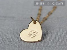 "This beautiful and personalized gold heart necklace would be a perfect graduation present or a gift for any loved one! The gold plated heart charm measures approximately 21x16mm (including jump ring) and is hung on a 16\", 18\" or 20\" gold plated or 14k gold filled chain. The chains are dainty and very pretty - the perfect delicate necklace for everyday wear. You can also add multiple hearts to the necklace. This sweet necklace is sure to be one of the recipient's favorite pieces of jewelry! I Customized Gold Charm Necklace With Heart Pendant, Customized Gold Heart Necklace For Mother's Day, Customizable Gold Heart Necklace For Gift, Customized Gold Heart Charm Necklace, Customized Gold Heart Necklace For Gift, Gold Heart Necklace With Custom Name For Gift, Gold Heart Necklace With Name For Anniversary, Customized Elegant Heart Necklace For Gift, Gold Heart Necklace For Anniversary Gift