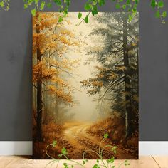 a painting on the wall of a forest with trees and leaves in fall colors is shown