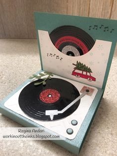 a record player with a christmas tree on it