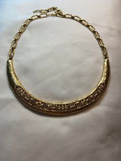 Vintage, gold tone, filagree necklace, adjustable hook clasp, 10-17 inches, excellent preowned condition. Antique Gold Filigree Necklace For Formal Occasions, Elegant Metal Necklace With Filigree Details, Elegant Metal Necklace With Filigree, Gold Filigree Necklace For Formal Occasions, Formal Gold Filigree Necklace, Formal Costume Jewelry Necklaces With Intricate Design, Antique Gold Metal Necklace With Filigree, Gold Filigree Necklaces For Evening, Gold Necklaces With Intricate Metal Design