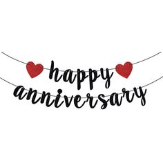 happy anniversary banner with two hearts hanging from the string and black lettering on white background