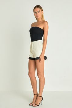 Get ready to elevate your summer wardrobe with our Contrast Satin Shorts. The stunning combination of satin contrast and folded bottom exudes a touch of luxury, perfect for any stylish occasion. The back pockets add convenience while the lining ensures comfort all day long. These shorts are versatile enough to dress up or down, making them a must-have for your seasonal wardrobe. Shop now and stand out from the crowd with our Contrast Satin Shorts. Satin contrast Back pockets Folded bottom Lining Chic High Waist Pants With Built-in Shorts, Elegant Short Summer Pants, Elegant Short Pants For Summer, Elegant High-waisted Shorts For Summer, Modern High Waist Summer Shorts, Spring Bottoms With Contrast Trim And Stretch Fit, Elegant High Waist Summer Shorts, Elegant Summer Shorts, Elegant High Waist Shorts For Day Out