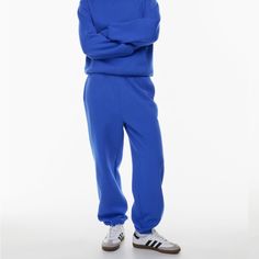 Never Worn Blue Sweats With Elastic Waistband For Winter, Blue Winter Sweats With Elastic Waistband, Blue Cotton Sweatpants With Ribbed Cuffs, Blue Relaxed Fit Bottoms With Ribbed Cuffs, Blue Bottoms With Ribbed Cuffs And Relaxed Fit, Blue Relaxed Fit Sweats With Pockets, Blue Relaxed Fit Sweatpants For Winter, Blue Cotton Joggers For Winter, Blue Cotton Winter Joggers