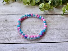 Handmade!! This bracelet is handmade with 6mm blue & pink crackle beads!  The bracelets are easy to get on and off with the stretch elastic, and would look great on their own or stacked with another bracelet! Size - 7in (average woman's size) *all bracelets are double strung for extra durability Trendy Stretch Bracelet With 8mm Beads For Gifts, Trendy 8mm Beads Stretch Bracelet Gift, Trendy Stretch Bracelet With 8mm Beads As Gift, Handmade Stretch Bangle Bracelet, Handmade Flexible Friendship Bracelets As Gift, Casual Stretch Bracelet Bangle As A Gift, Flexible Bohemian Stretch Bracelet As Gift, Bohemian Stretch Bracelet As Gift, Bohemian Stretch Bracelet Gift