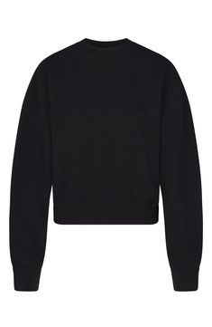 You'll want to lounge all day in this supersoft fleece pullover in a comfy, classic silhouette from Kim Kardashian's SKIMS. 22" length (size medium) Crewneck Long sleeves 70% cotton, 30% polyester Machine wash, dry flat Imported Cozy Cropped Sweater With Ribbed Crew Neck, Cozy Cropped Sweater With Ribbed Collar, Black Cropped Crew Neck Sweater With Ribbed Cuffs, Black Crew Neck Cropped Sweater With Ribbed Cuffs, Cozy Cropped Sweater With Crew Neck And Ribbed Cuffs, Oversized Cropped Sweater With Ribbed Cuffs For Loungewear, Comfy French Terry Sweater With Ribbed Cuffs, Fall Crew Neck Cropped Sweater With Ribbed Waistband, Crew Neck Cropped Sweater With Ribbed Waistband For Fall