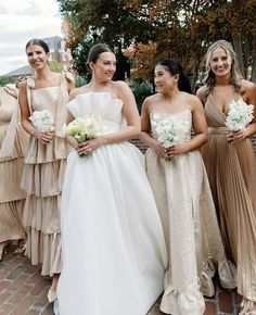 a bride posing with her bridesmaids carrying a small, simple white bouquet and her bridesmaids in mismatched champagne colored formal dresses Small Wedding Bouquet Simple, Wedding Bouquet Simple, Small Wedding Bouquet, Champagne Formal Dress, Simple Wedding Bouquet, Jesus Wedding, Champagne Formal Dresses, Mix Match Bridesmaids, Small Wedding Bouquets