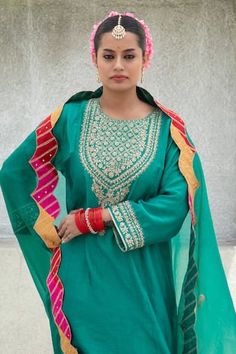 Bottle green straight kurta with floral, sequin, dori embroidery on the yoke and cuffs. Paired with a pant with embroidered hem. Comes along with a dupatta with scallop trims and contrast border. - Aza Fashions Green Anarkali Palazzo Set With Embroidered Border, Bollywood Green Palazzo Set With Embroidered Border, Green Bollywood Palazzo Set With Embroidered Border, Unstitched Pista Green Palazzo Set With Embroidered Border, Green Sharara With Embroidered Border For Navratri, Green Sharara With Embroidered Border For Diwali, Designer Wear Green Sharara With Embroidered Border, Designer Green Sharara With Embroidered Border, Green Palazzo Set With Dori Work And Straight Kurta