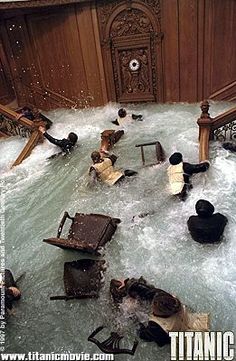 several people in an indoor hot tub surrounded by water