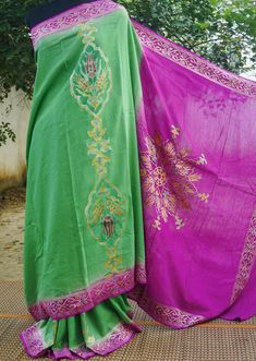 Category: Moonga Silk Saree Get ready to wear this stunning Banarasi silk saree. Woven with passion and excellence, this Handloom Banarasi silk saree won't fail to catch attention. Moonga silk sarees are known for their longevity and resilience, they make you fall in love with them. Color -Green & Purple with hand brush Weave -Cutwork Blouse- Plain with zari border Note- There may be slight color variations due to photographic reasons. This is a hand-woven product and any irregularities in the w Bohemian Style Pre-draped Saree In Slub Silk, Bohemian Style Pre-draped Slub Silk Saree, Bohemian Silk Pre-draped Saree For Festivals, Green Pre-draped Saree With Motifs In Art Silk, Pista Green Silk Saree For Festivals, Traditional Green Silk Shawl, Bohemian Pre-draped Saree In Slub Silk For Diwali, Bohemian Style Slub Silk Pre-draped Saree For Diwali, Green Bohemian Silk Traditional Wear