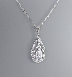 "Elegant and classical 'modern' vintage! Marquise crystals surrounding a tear shaped crystal set in a filigree teardrop design have the same sensational sparkle as real diamonds and create a lovely simple pendant with a subtle 'wow' factor. 💜 Available in rose gold, silver (rhodium) and gold ★Please note: This listing is for the necklace ONLY. Measurements: Pendant length - 1 1/4\" (3 cm) Chain length - 16.5\" with extender - 18.5\" (41 cm - 46 cm) The coordinating earrings in photos 3 & 4