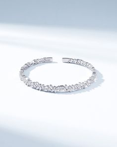 Elevate your wrist-wear with the Classic Diamond Sparkler Bangle, a testament to Suzanne's' signature design. This exquisite bangle, is set in luxurious 18k gold and boasts 1.53 carats of meticulously arranged baguette and round white diamonds. Details 18k yellow gold, rose gold or white gold 1.53 carats of baguette and round white diamonds 5mm width Ref: AKB270 White Gold Bangle With Baguette Diamonds, Fine Jewelry White Gold Bangle With Baguette Diamonds, Elegant Diamond Bangle With Baguette Diamonds, Wedding Bangle In White Gold With Baguette Diamonds, Elegant Cubic Zirconia Bangle With Baguette Diamonds, Elegant Bangle With Baguette Cut Diamonds, Elegant White Gold Bangle With Baguette Diamonds, Wedding Diamond Baguette Cut Bangle, Wedding Diamond Bangle With Baguette Cut