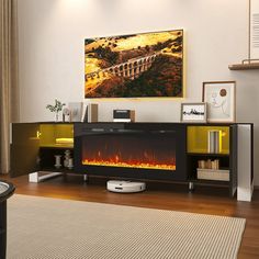 a living room with a fire place in the center and a painting on the wall