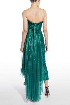 The breathtaking LUISE dress features a boned bodice and an asymmetrically draped silhouette. Crafted from precious metallic silk mousseline, Luise has an alluring lace-up back which ensures the perfect fit. The skirt follows the bodyline revealing a high slit under the draped panel which elegantly falls on the side
#eveningwear #fashion #style #prom #bridal #formalwear #redcarpet #sweet16 #model   #gowns #weddings #bridesmaids #prom2022 #sweetsixteen #homecoming #quinceanera #bridesmaids Feather Prom Dress, Maria Lucia Hohan, Strapless Evening Dress, Womens Prom Dresses, Silk Tulle, Boned Bodice, Teal Dress, Pleated Fabric, Basic Dress