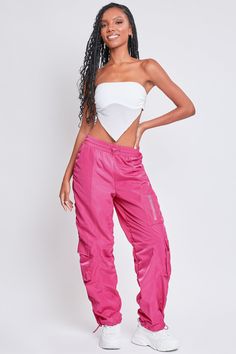 It’s giving off-duty vibes! Our Women's High-Rise Rouched Nylon Jogger is the perfect baggy pant to add to your wardrobe! Designed with an adjustable bungee cord at the elasticized waistband for the perfect fit and comfort. These high waisted pants are meant to be oversized with a baggy and slouchy fit. Featuring silver hardware and large cargo pockets for a sporty-chic vibe. We’ve also added adjustable bungee cords at the bottom hems to give you the option of wearing them more scrunched up at t Nicki Minaj Concert Outfit, Nicki Minaj Concert, Nicki Minaj Pink Friday, Ymi Jeans, Bungee Cords, Pink Friday, All Jeans, Bungee Cord, Cargo Joggers