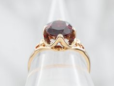 This stunning ring is crafted from luxurious yellow gold and set with a stunning garnet. Perfect for special occasions, this ring is sure to make a lasting impression.Metal: 10K Yellow GoldGem: Pyrope Garnet 3.83 CaratsGem Measurements: 8.2 x 10.0 mm, OvalRing Size: 7.50Marks: "10K PC" Stamped on the inside band Yellow Gold Garnet Rings With Prong Setting, Formal Garnet Birthstone Ring, Formal Gold Diamond Ring With Garnet, Yellow Gold Garnet Rings For Anniversary, Formal Garnet Birthstone Ring Fine Jewelry, Formal Garnet Birthstone Ring In Fine Jewelry Style, Gold Garnet Birthstone Ring, Yellow Gold Garnet Rings, Yellow Gold Garnet Birthstone Ring