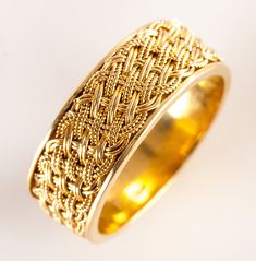 18k Yellow Gold Woven Style Wedding Anniversary Band Ring 5.22g 7.1mm WidthMetal Information: 18k Yellow GoldTotal Weight: 5.22gBand Width: 7.1mmSize: 6.25Estimated Retail Price: $1065.00OUR PRICE: $850.00SizingMany of our pieces can be re-sized at the buyers request. Please email us if you require our skilled professional services.44781 Heirloom Yellow Gold Bands With Decorative Details, Yellow Gold Bands With Intricate Design, Yellow Gold Wide Band Fine Jewelry, Wide Band Yellow Gold Fine Jewelry, Yellow Gold Bands With Intricate Design In 14k, Wide Band In Yellow Gold Fine Jewelry Style, Classic Yellow Gold Band With Intricate Design, 14k Yellow Gold Bands With Intricate Design, Intricate Design 14k Yellow Gold Bands