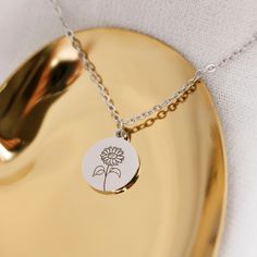 "BIRTH FLOWER NECKLACE: Flowers that won't ever lose their bloom. Makes a perfect gift, or go-to piece for yourself. This listing is for 01 necklace with one or multiple pendants. 18K Gold Plated, 18K Rose Gold Plated. -------------------------- Details: * High polished stainless steel * Disc measures 12mm x 14mm * 1.5mm Stainless Steel, 18K Gold Plated, 18K Rose Gold Plated Chain 18\" * Engraved with a high precision laser engraver, clear and easy to read. * Handmade to order, please allow 1-3 Flower Charm Necklace For Mom, Flower Charm Necklaces For Mom, Flower Charm Necklace Perfect Gift For Mom, Mother's Day Flower Charm Round Pendant Necklace, Flower Charm Necklace For Her, Nickel-free Flower Necklace As Gift For Mom, Nickel-free Flower Necklace For Mom, Adjustable Flower Charm Necklace For Mom, Adjustable Flower Charm Necklace As Gift For Mom