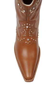 Polished studs and sparkling crystals put a contemporary spin on this stacked-heel Western boot. Leather upper/synthetic lining/leather sole Imported Western Pointed Toe Boots With Rhinestone Rivets, Leather Boots With Rhinestone Rivets And Round Toe, Studded Leather Moto Boots With Pointed Toe, Fall Leather Boots With Rhinestone Rivets, Leather Boots With Rhinestone Rivets And Pointed Toe, Studded Leather Boots With Pointed Toe, Leather Heeled Boots With Rhinestones And Round Toe, Leather Boots With Rhinestones And Round Toe, Leather Rhinestone Boots With Round Toe