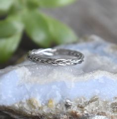 "Minimalist Braid Band: -.925 solid sterling silver -2.3mm width braid band -US sizes 4-12.5 with half sizes. -Photos with double braid for size comparison -please note video depicts the double braid underneath the single for comparison. Ty! Link to the larger Braided Ring: https://www.etsy.com/shop/AWildViolet?ref=seller-platform-mcnav&search_query=braid All rings: https://www.etsy.com/shop/AWildViolet?section_id=13958646&ref=shopsection_leftnav_2 💜Check out our new \"Ready to Ship\" section f Teal Rings, Braided Ring Band, Halloween Ring, Wolf Ring, Rope Ring, Rope Rings, Double Braid, Braided Ring, Celtic Rings