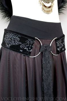 "** NEW ITEM ** BLACK EMBOSSED VELVET tie-front hip belt with BLACK VELVET TRIM, big gunmetal d-rings, extra long lace scarf, and heavy duty corset elastic backing. 100% handmade and animal friendly! WINE + CHAMPAGNE OMBRÉ SKIRT: https://www.etsy.com/listing/875709715/ SIZES + BELT LENGTHS: XS :: 29\" S :: 32\" M :: 35\" L :: 38\" XL :: 41\" XXL (2X) :: 45\" FOR AN IDEAL FIT, your belt length should measure a few inches smaller than your full hips: the widest part of your lower body. All orders Hip Scarf Outfit, Whimsigoth Belt, How To Style A Black Skirt, Witch Belt, Hip Accessories, Temu Clothing, Goth Belt, Black Corset Belt, Big Belt