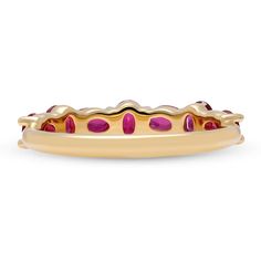 Vibrant oval shape rubies rest securely in prongs as they are set in a unique interchanging pattern creating an alluring and stylish look in this elevated and minimalistic design. The low profile construct allows for it to be worn flush against the finger, ideal for stacking. Wear it alone or layer it together with other similar versions. Metal: 18kt Gold Ruby Weight: 1.50 ct. Measurements: 4.0 mm length *Please note that the listed ct. weights are approximate and may be subject to slight variat Luxury Oval Ruby Ring With Prong Setting, Luxury Oval Ruby Ring With Polished Finish, Oval Ruby Rings With Single Cut Diamonds, Luxury Oval Ruby Birthstone Ring, Formal Oval Ruby Ring With Single Cut Diamonds, Luxury Marquise Cut Yellow Gold Ruby Ring, Luxury Yellow Gold Ruby Ring With Marquise Cut, Luxury Yellow Gold Ruby Ring With Round Band, Luxury Oval Yellow Gold Ruby Ring