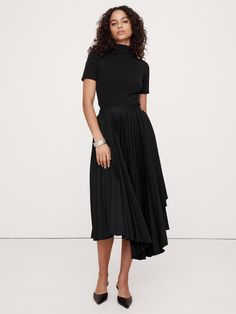 Our iteration of the season's pleated midi skirt relies on a twill fabric we love for its soft structure, which give it the ability to hold crisp pleats that layer in asymmetric panels for an architectural effect.  High waisted.  A-line.  Zip closure at side.  Unlined.  High waisted.  A-line.  Midi length.  Model: Size 2, 5'10" (178cm). Thai Orchid, Asymmetrical Midi Skirt, Sequin Midi Skirt, Maxi Styles, Black Midi Skirt, Women's Skirts, Pleated Midi Skirt, Style Mistakes, Twill Fabric