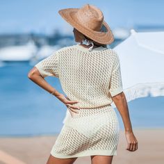 Looking for a relaxed beach vibe? The Apricot Drop Shoulder Open Knit Mini Cover-Up is perfect for sunny days. With its drop shoulder design and open knit fabric, this mini cover-up provides a breezy, laid-back fit. Wear it as a stylish cover-up over your swimsuit or pair it with sandals and accessories for a fashionable beachside ensemble that will turn heads wherever you go. Product code: CAA07C4F005KK Casual Summer Beach Dress Cover-up, White Cover-up For Beach Season, Casual Beach Cover-up For Resort Season, Lightweight Cover-up For Beach Season, Lightweight Summer Cover-up For Day Out, Lightweight V-neck Cover-up For Summer, Lightweight V-neck Summer Cover-up, Beachy Short Sleeve Beach Dress For Day Out, Summer V-neck Cover-up For Day Out