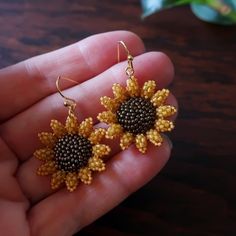 Two small and dainty sunflowers, hand beaded using hundreds of super-tiny glass beads, strung and stitched one at a time. Mini sunflowers measure just over 1 inch (28mm) each. Total length of earrings with ear wires: 1.5 inches (40mm.) © 2020-2021 Heart in Hawaii Available in larger size; sold separately Matching brooch available; sold separately Professionally handmade in the US Truly unique; exclusive design; direct from the artist Gift wrapping and 1st Class US shipping included Nickel-free Yellow Beaded Earrings As Gift, Nickel Free Yellow Beaded Earrings For Gift, Nickel-free Yellow Beaded Earrings For Gifts, Yellow Jewelry With Tiny Beads For Gift, Beaded Flower Earrings Gift, Gold Sunflower Adjustable Flower Earrings, Round Beaded Flower Earrings For Gifts, Yellow Round Beaded Earrings For Gifts, Handmade Gold Flower Earrings With Round Beads