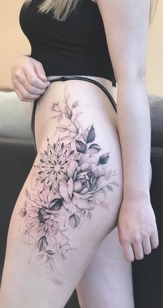 a woman's thigh with flowers on it