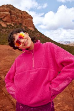 a woman wearing a pink sweater and sunglasses Half-zip Winter Sweatshirt For Outdoor Activities, Winter Functional Half-zip Sweatshirt, Fleece Half-zip Sweatshirt For Outdoor, Functional Half-zip Winter Sweatshirt, Half-zip Fleece Sweatshirt For Outdoor, Outdoor Half-zip Fleece Top, Fleece Half-zip Top For Outdoor, Functional Fleece Half-zip Sweatshirt, Pink Fleece Jacket For Outdoor Activities