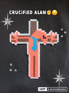 the cross is made out of plastic beads and embellished with an embellishment